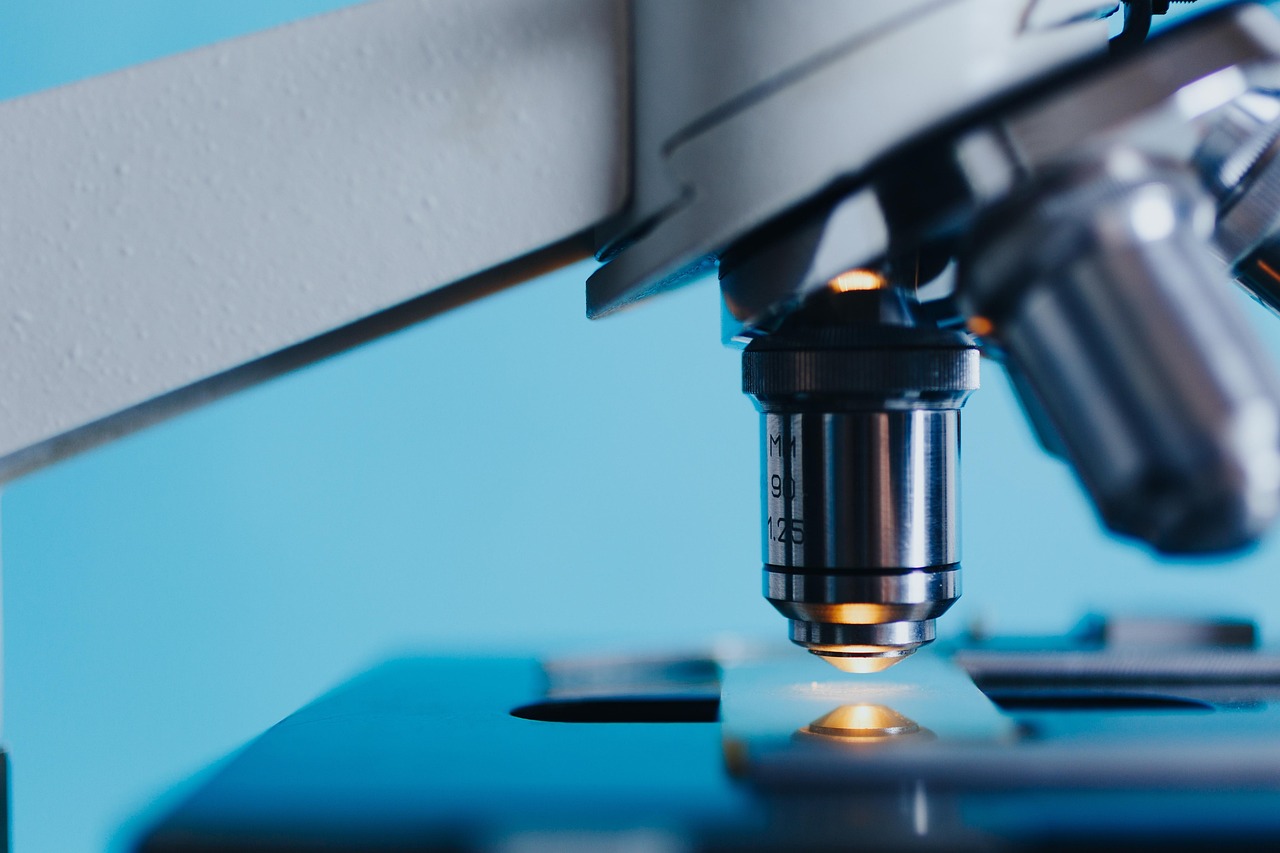 A close-up view of a laboratory microscope, representing scientific research.