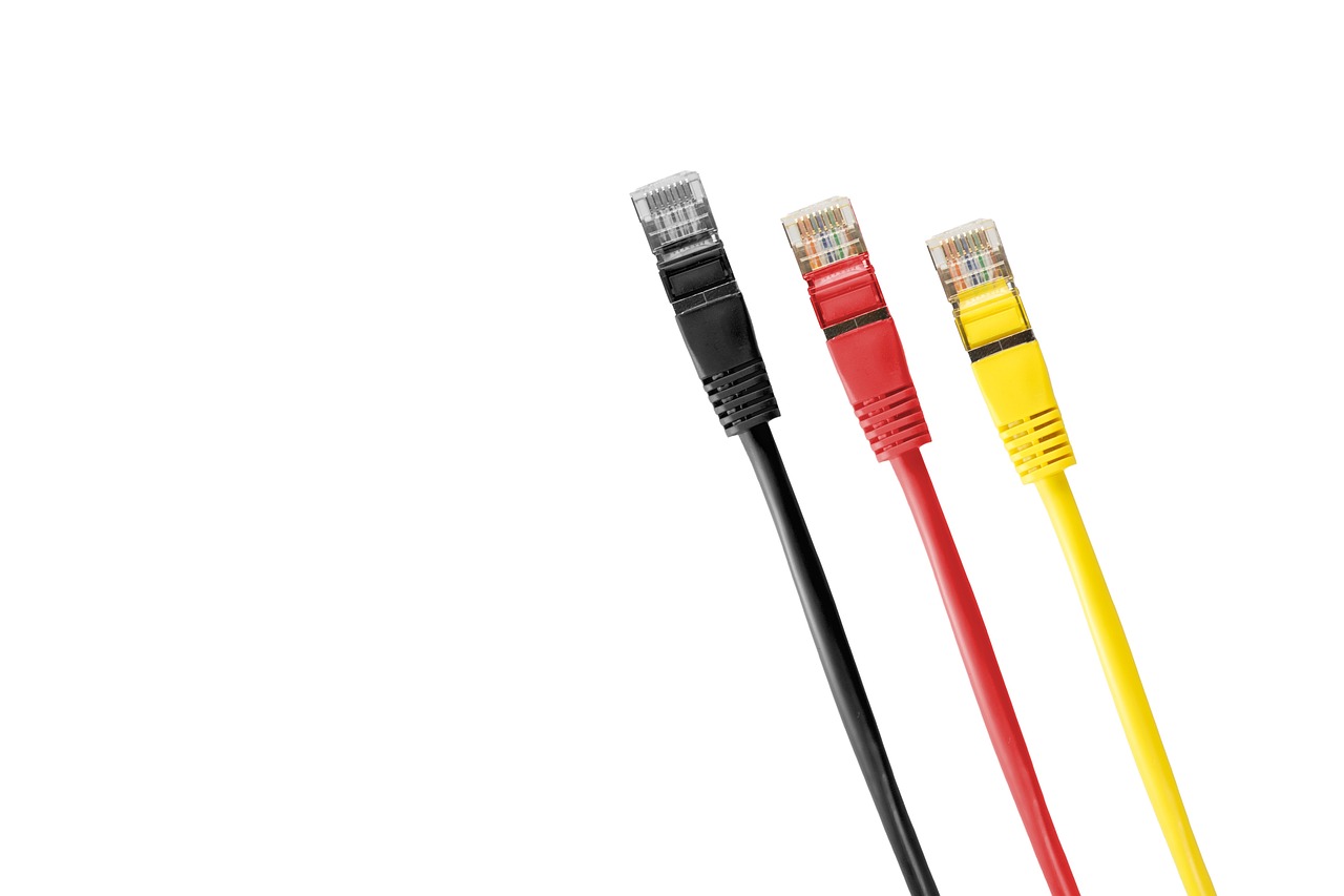 Three Ethernet cables with black, red, and yellow connectors against a white background